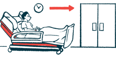 A patient on a stretcher is being wheeled down a hallway toward a set of double doors.