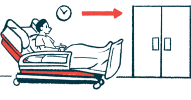 A patient reclines on a hospital gurney waiting just outside two double doors.