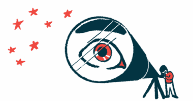 A person's eye is magnified in the lens of a telescope as he looks at stars.