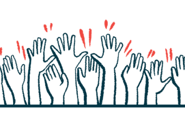 Multiple hands are seen raised in the air.